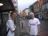 Merlin and Rick at bus stop. Hungover